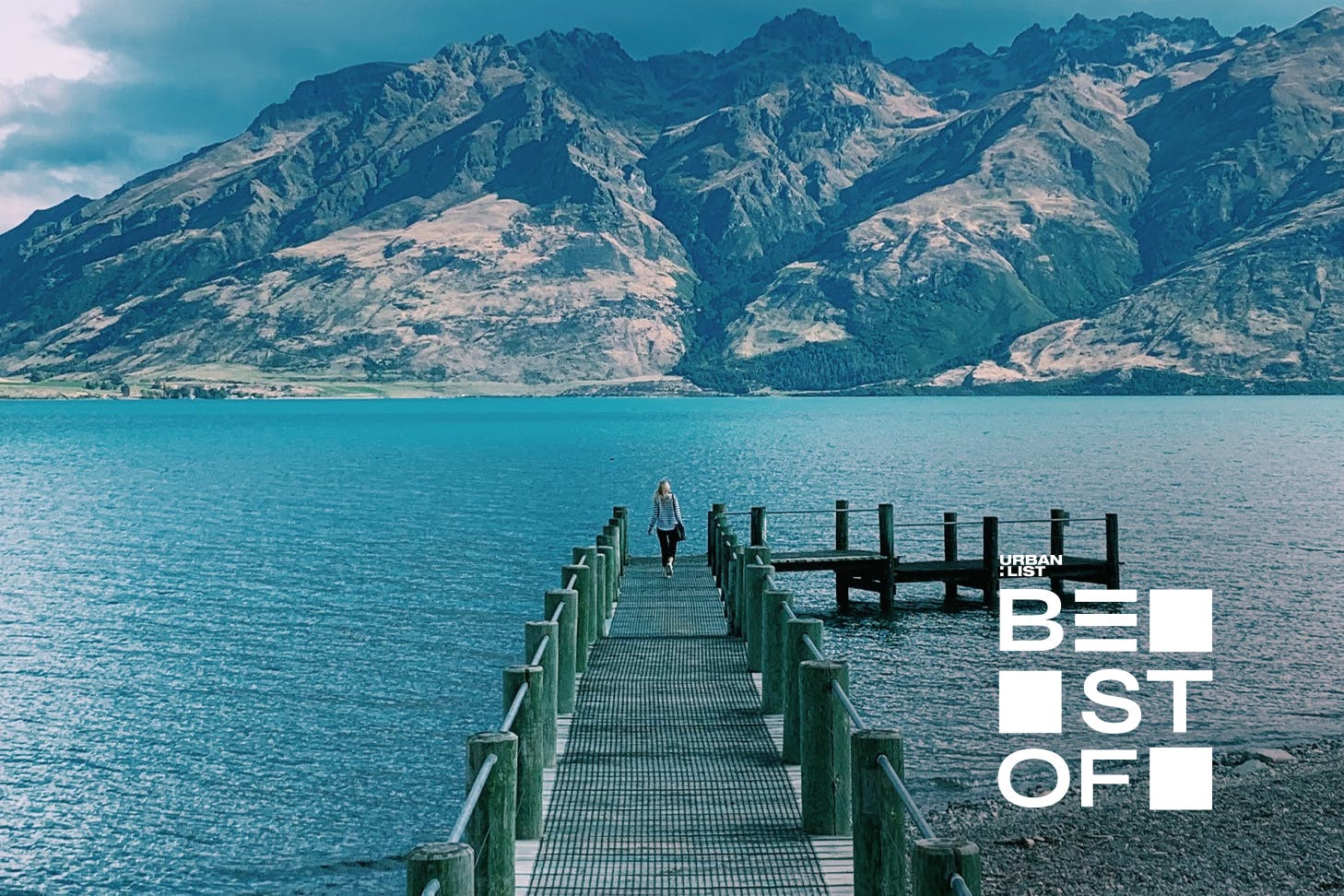 Someone walks along the pier in Queenstown.